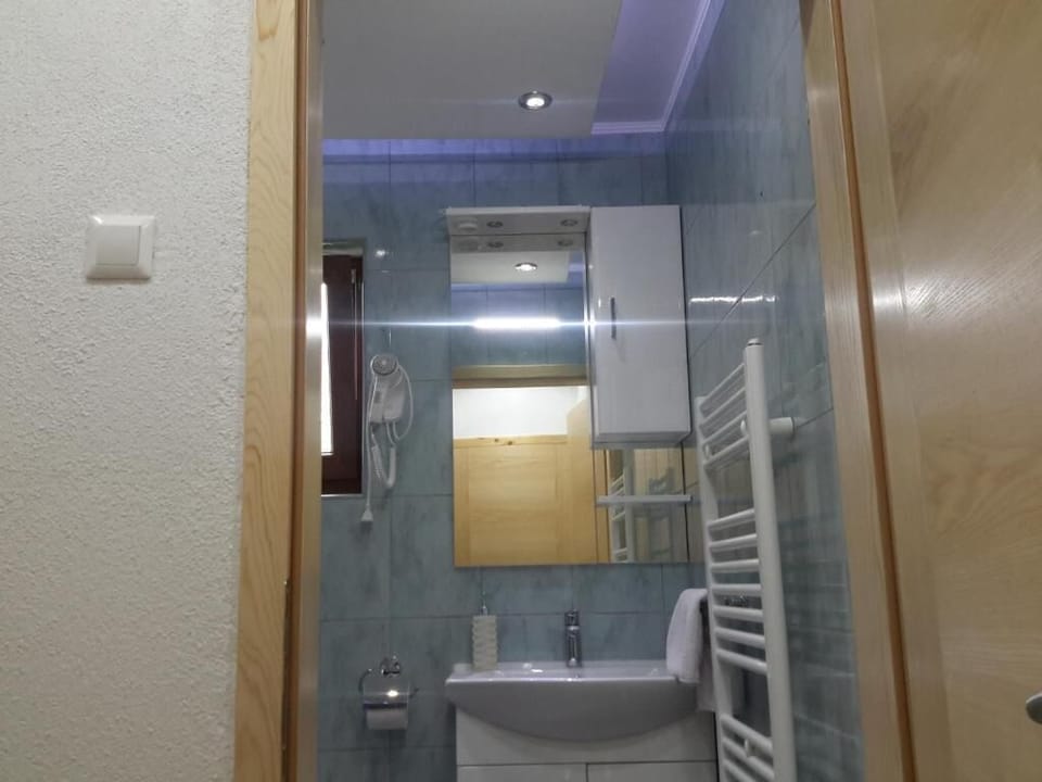 Superior Triple Room, Courtyard View | Bathroom | Shower, hair dryer, towels, soap