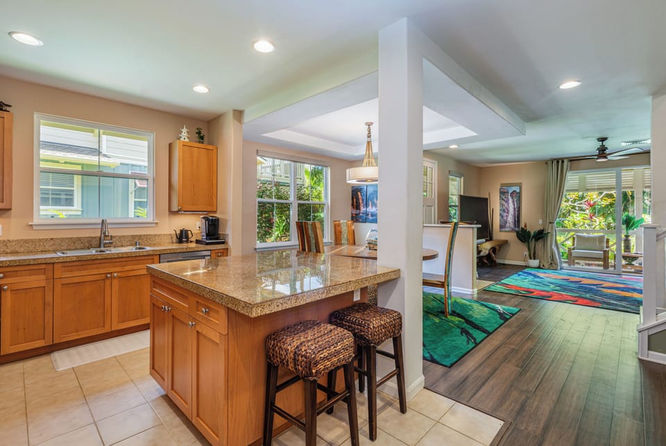 The kitchen counter space comfortably seats four, perfect for family meals.