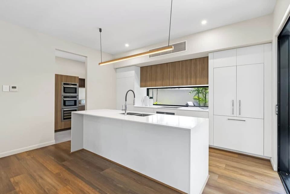 Create culinary delights in the gourmet kitchen, featuring premium appliances, a spacious island, and a hidden butler’s pantry.