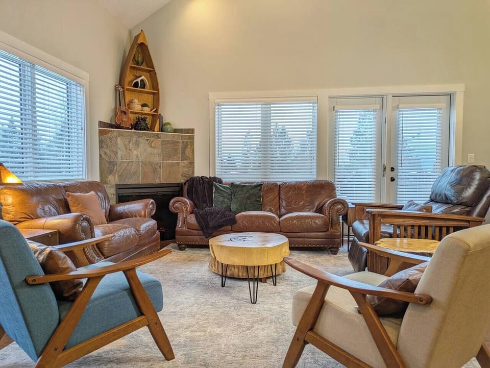 cathedral ceilings | mountain views | patio with BBQ and table | electric fireplace