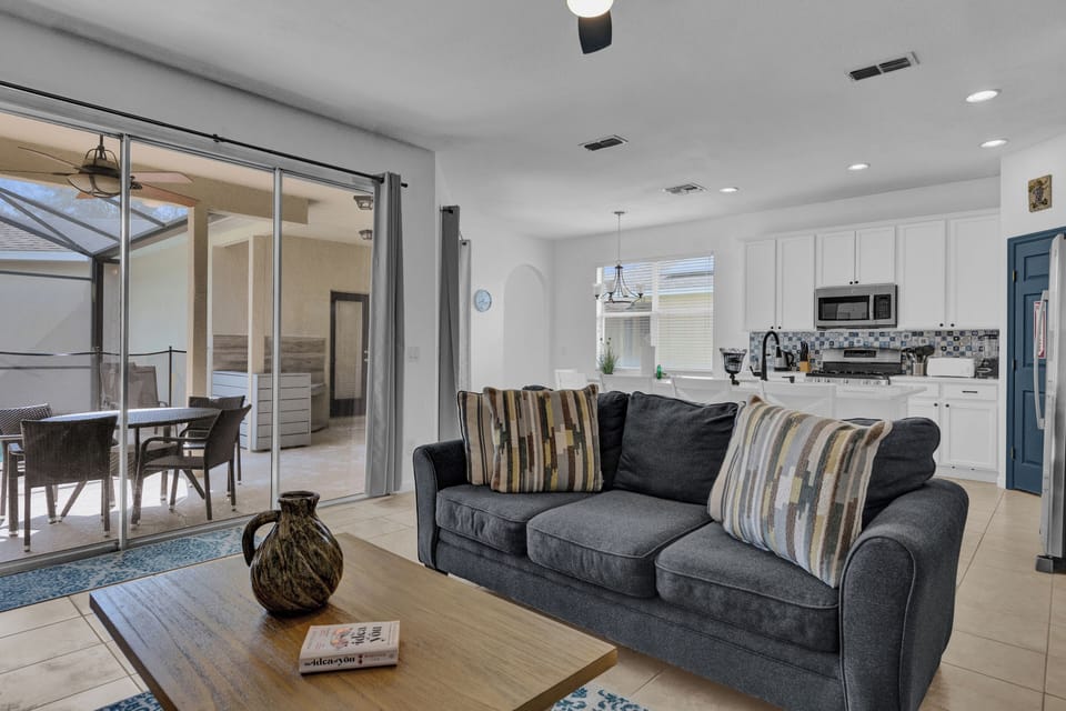 Living Room with Patio & Kitchen View