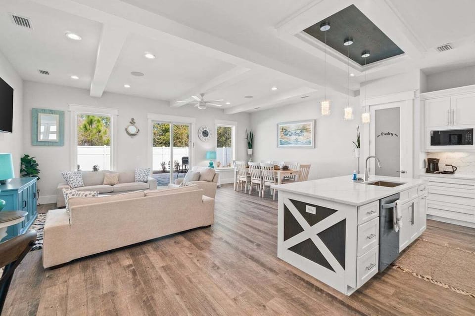 Open concept living room + kitchen + dining area, perfect for entertaining your group!