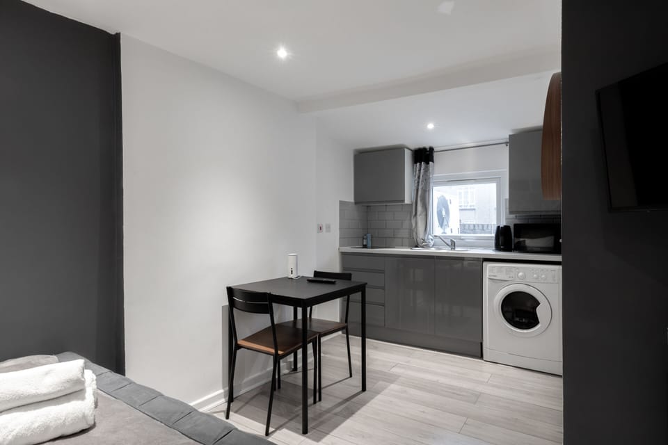 Apartment, Private Bathroom | Desk, laptop workspace, iron/ironing board