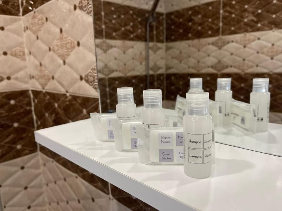 Separate tub and shower, towels, soap, shampoo