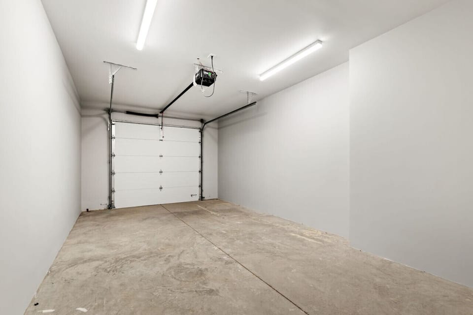 Garage on the main level. Take hallway to the elevator up to your unit. 