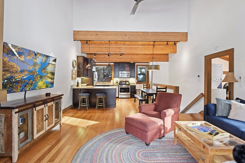 Open living space with Smart TV, and balcony
