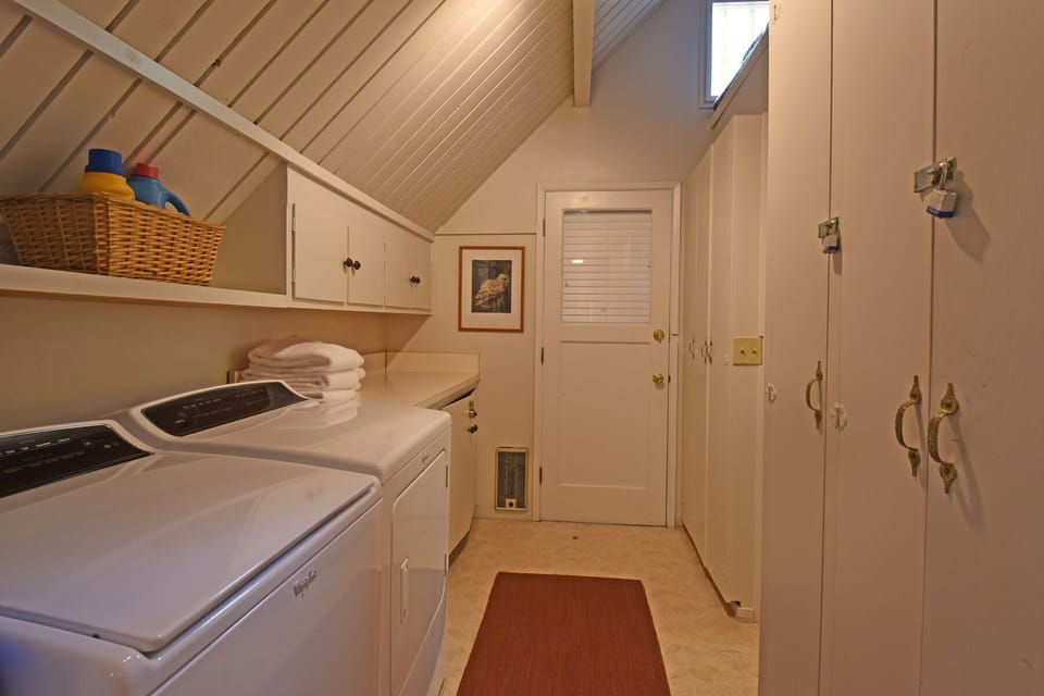 Private laundry room w/ washer and dryer