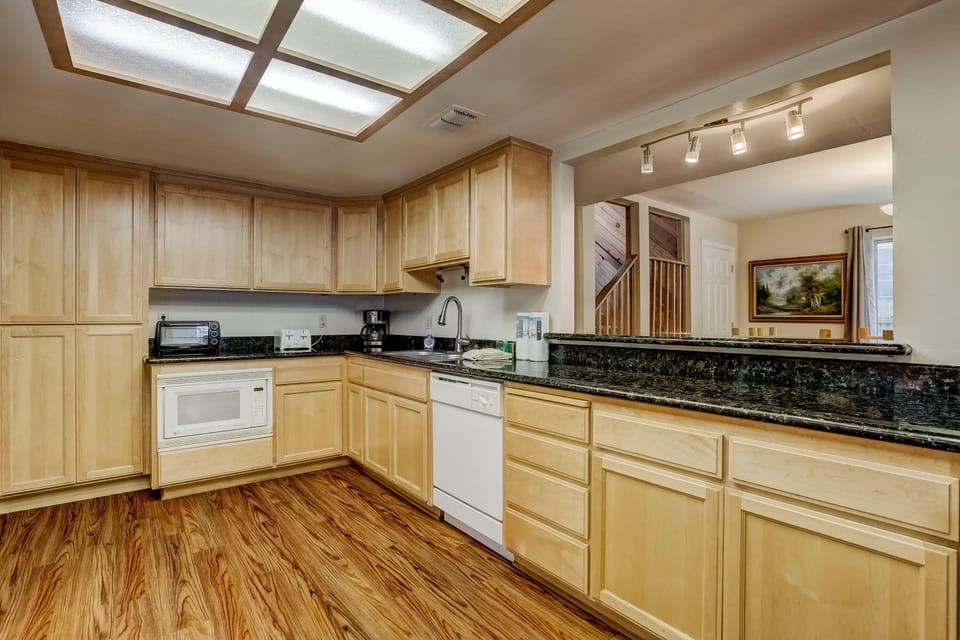 Full kitchen with drip coffee maker, toaster, kettle and more