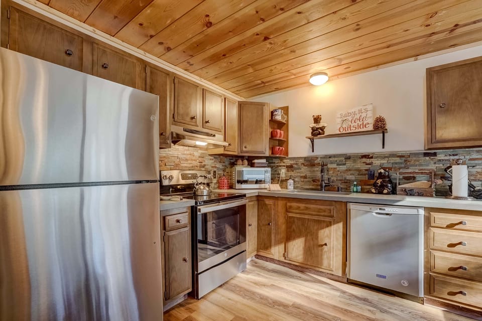 Full kitchen with stainless steel appliances