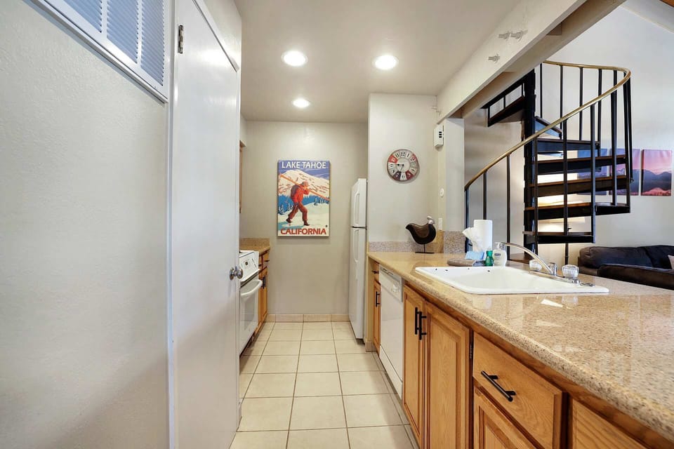 Galley way kitchen overlooking living room