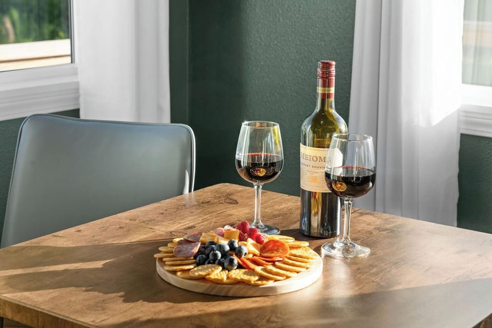 Savor a romantic moment with wine, charcuterie, and warm natural light.