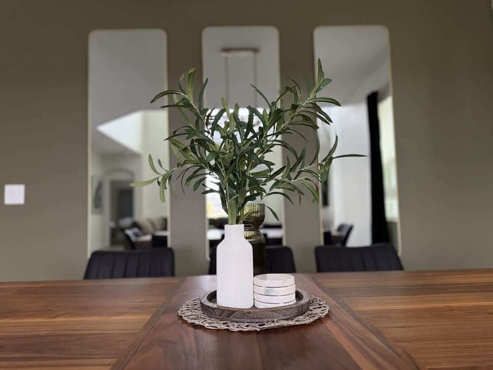 Admire the stylish details of our dining area, anchored by a beautiful centerpiece that adds a touch of elegance to every meal