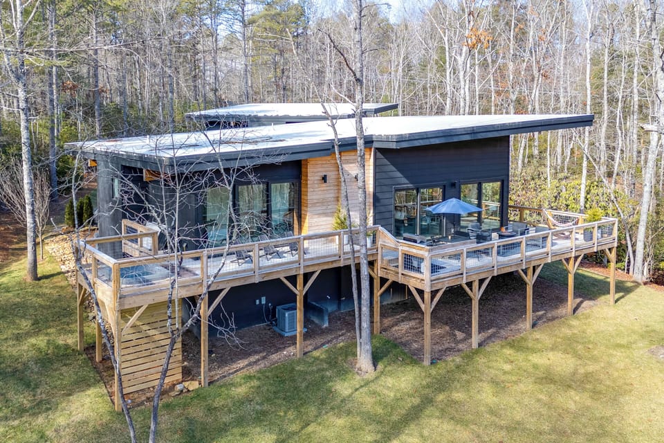 Property Exterior | Deck w/ Hot Tub | Forest Views | 4 Mi to Downtown Brevard