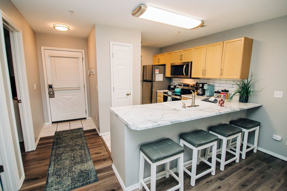 Standing in Dining Room looking back at the kitchen and entry door