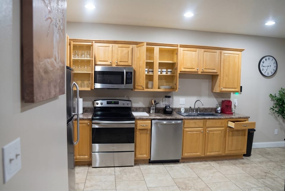 Bright full kitchen with stainless appliances and plenty of prep space