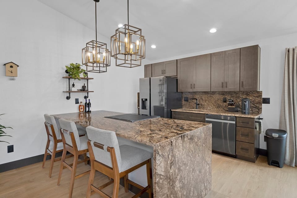 Fully equipped, luxurious kitchen with bar and dining area