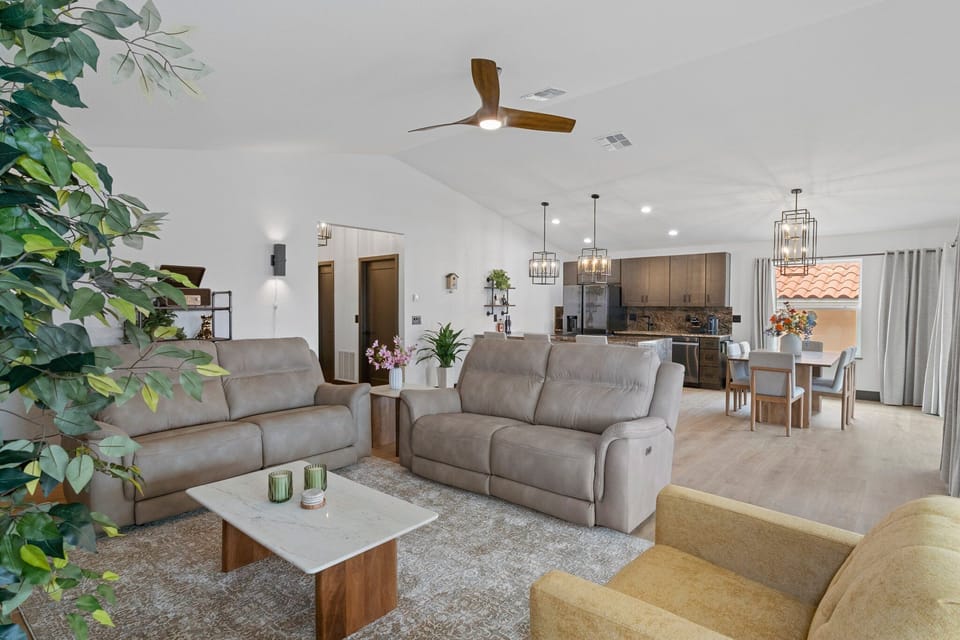 Living area with the kitchen and dining area in the background
