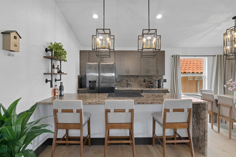 Fully equipped, luxurious kitchen with bar and dining area