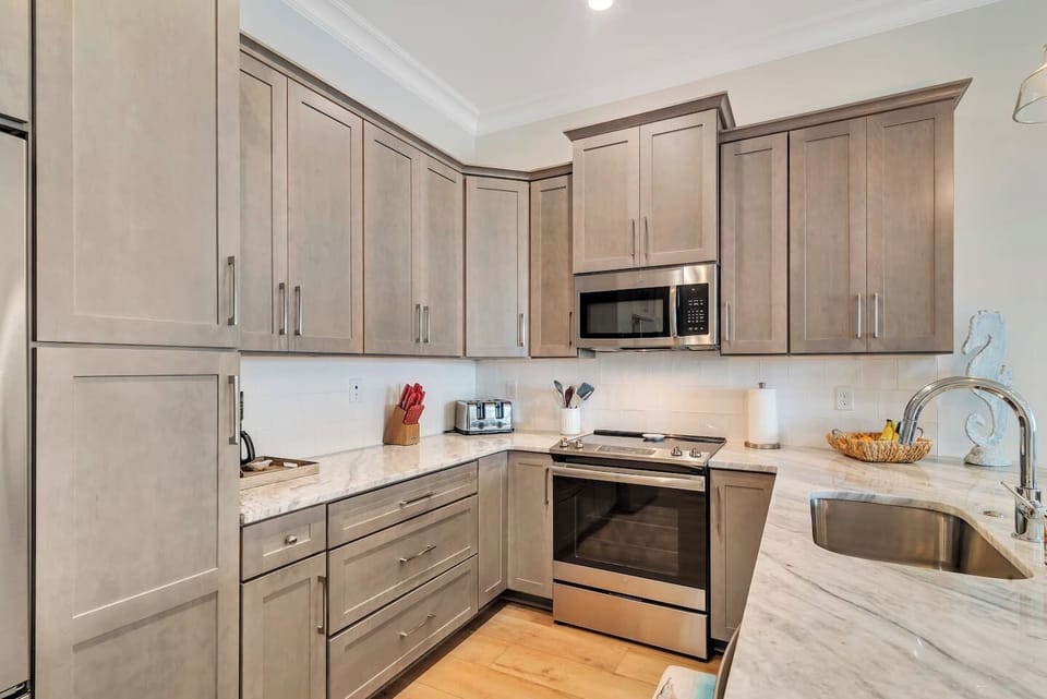 Microwave, Oven, dishwasher, garbage disposal, coffee maker, ice maker, refrigerator, plus a water dispenser inside the refrigerator.
