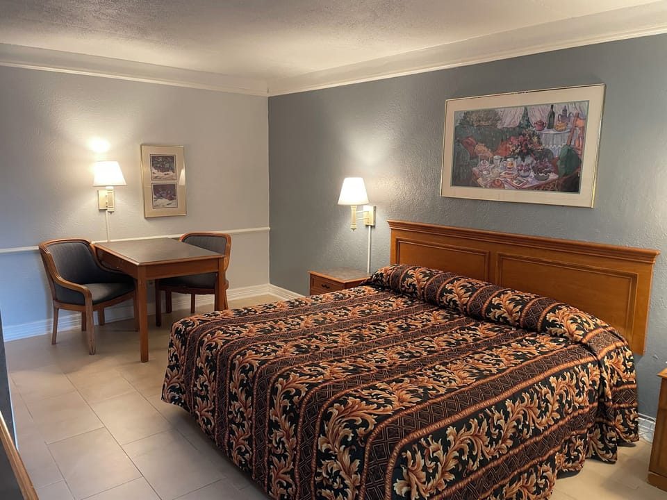 Down comforters, desk, blackout drapes, iron/ironing board