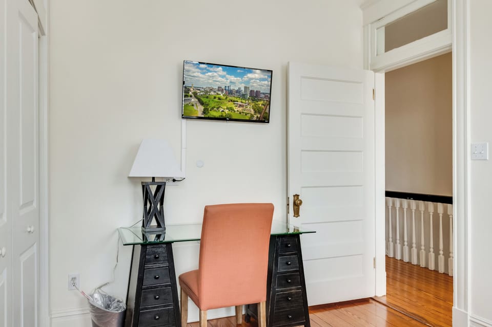 Queen Bedroom 1 Workspace: Bright desk area with city views, perfect for productivity or relaxation!