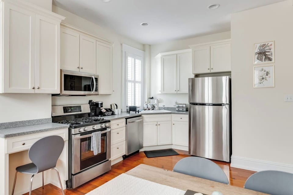 Kitchen: Modern charm with stainless appliances and sunny vibes for culinary adventures!