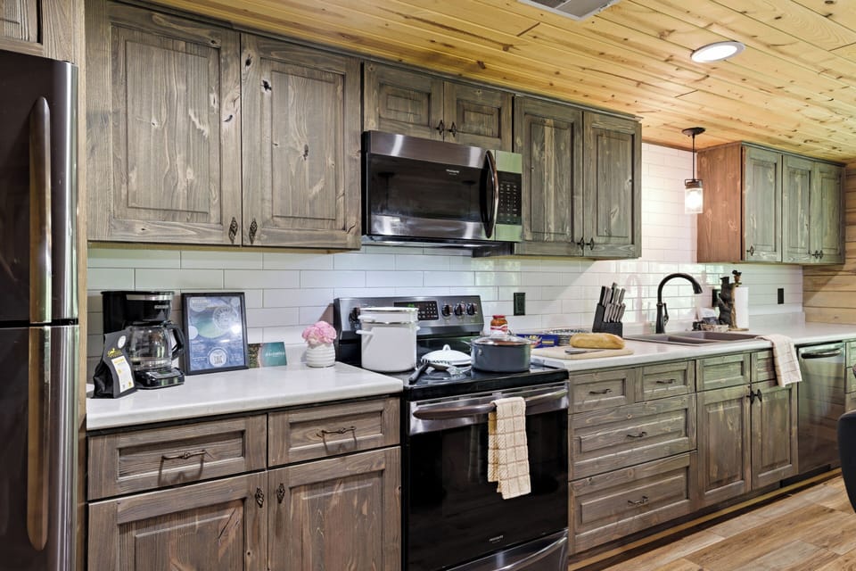 Enjoy a warm, rustic kitchen with modern appliances, plenty of cabinet space, and everything you need to cook, snack, and gather during your stay.