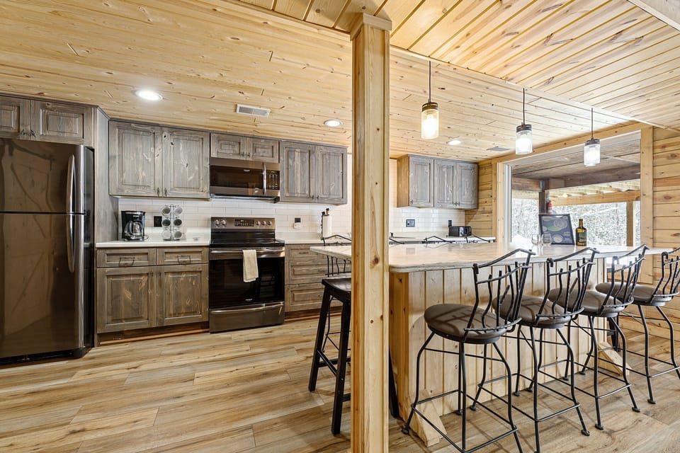 Spacious island with plenty of seating, seamlessly connecting the kitchen and living area