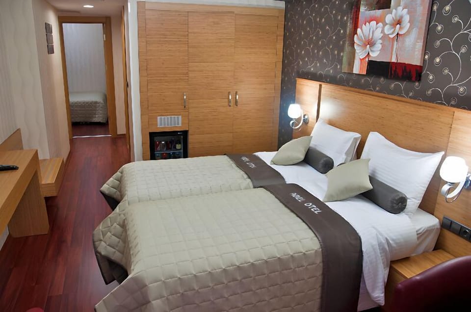 Standard Triple Room | Minibar, in-room safe, soundproofing, free WiFi