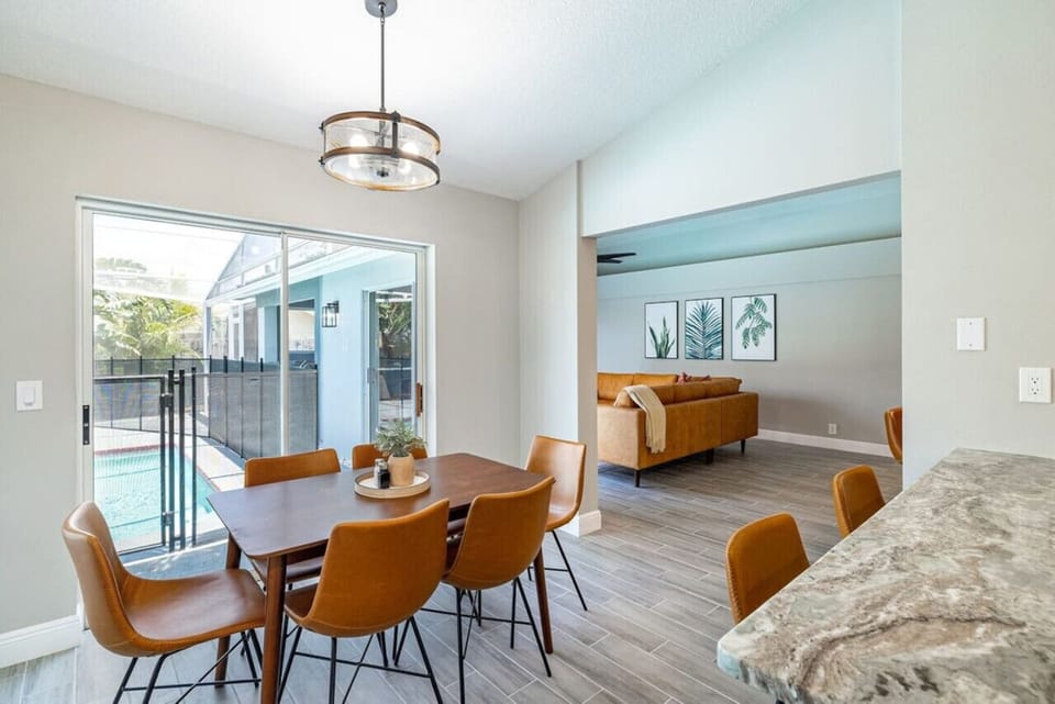 Dine with pool views in this bright and inviting dining area.