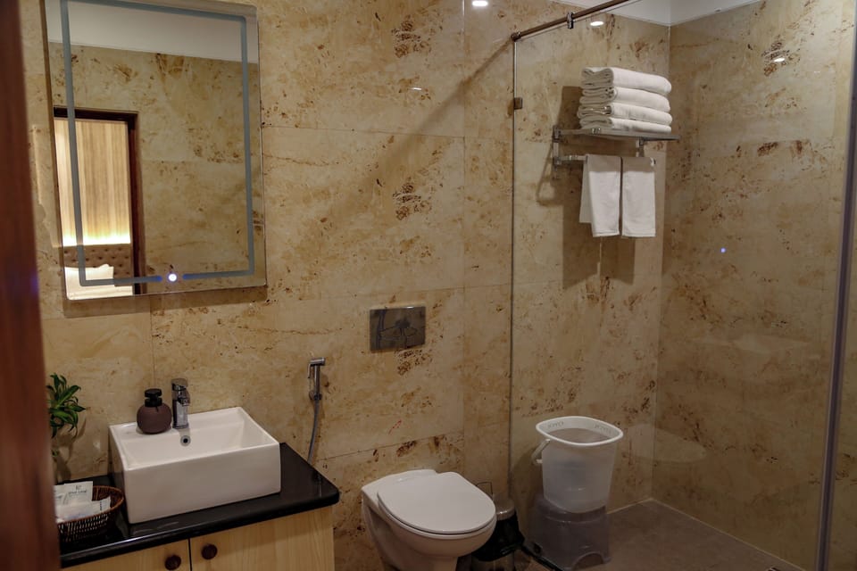Shower, free toiletries, hair dryer, slippers