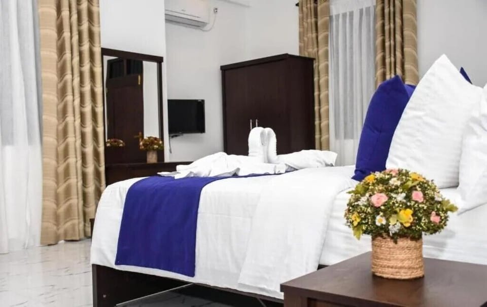 Deluxe Triple Room, Garden View | Desk, soundproofing, iron/ironing board, free WiFi