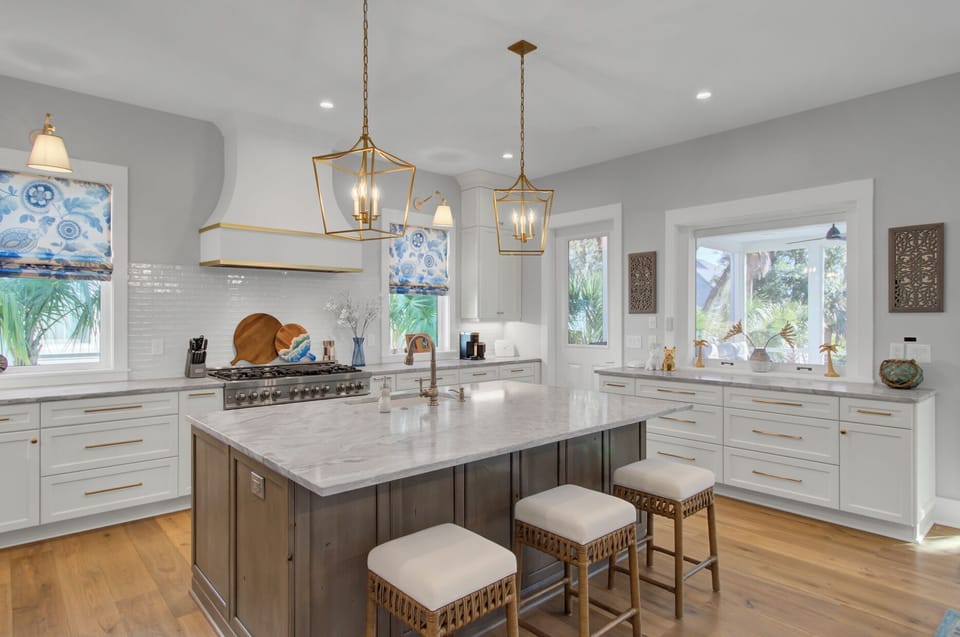 Fully equipped kitchen with barstool seating.