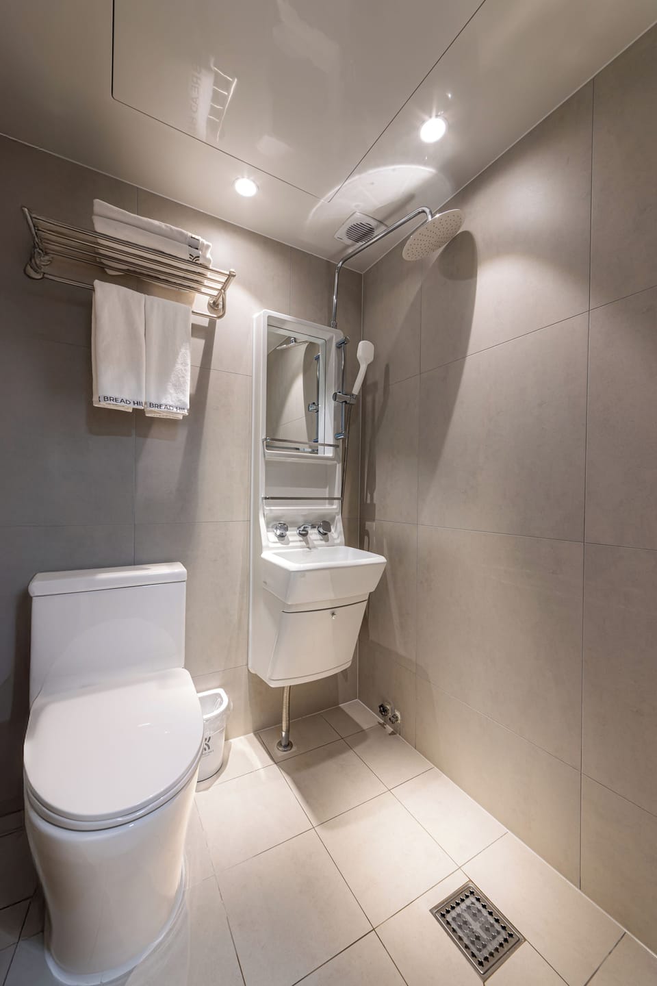 Shower, hair dryer, slippers, towels