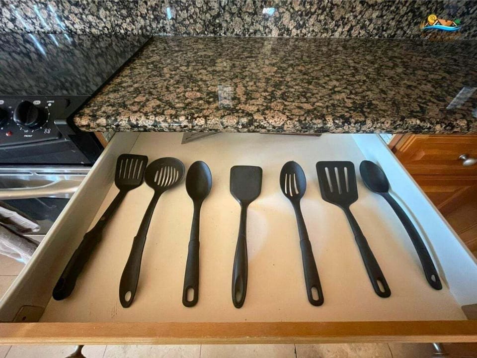 This 3-bedroom, 2-bath El Dorado Ranch rental includes a fully stocked kitchen with cooking utensils, plates, glasses, and silverware.