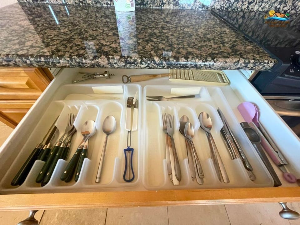 The kitchen at Condo 11-3 includes a full set of cooking utensils — ready for home-cooked meals just steps from the community pool in El Dorado Ranch.