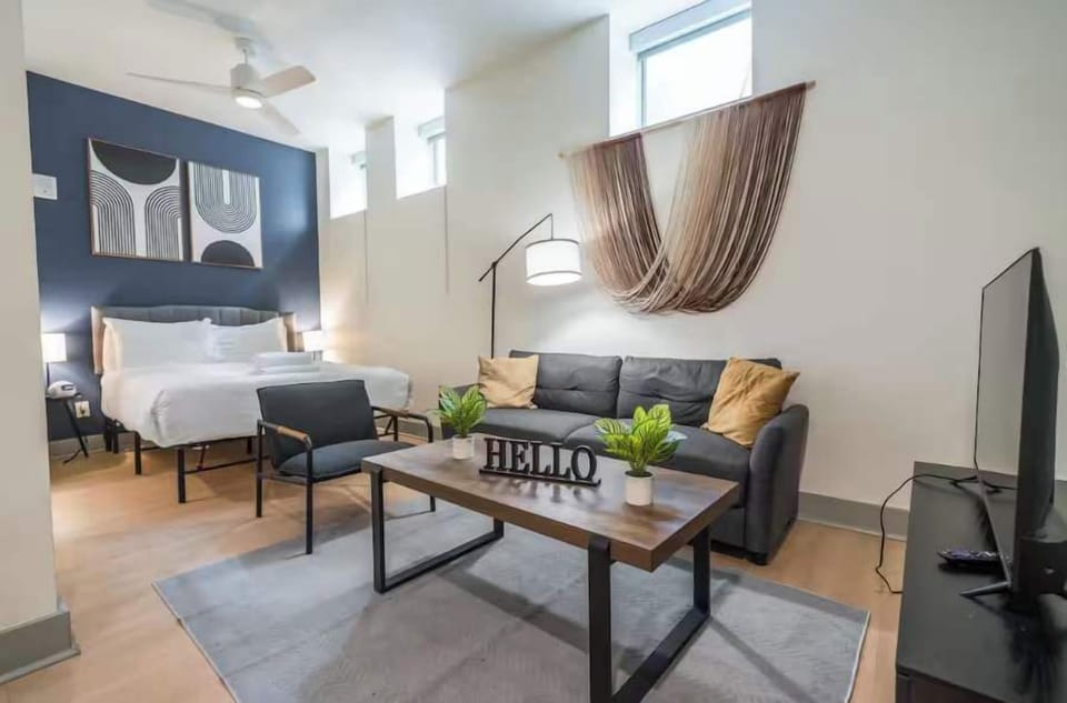 Unit #107- Living space and queen bed