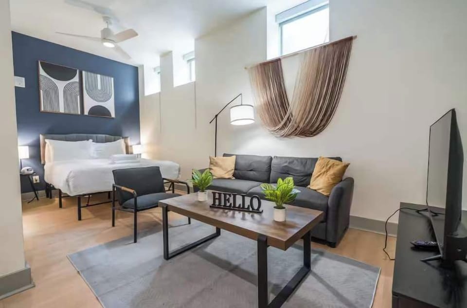 Unit #107- Living space and queen bed