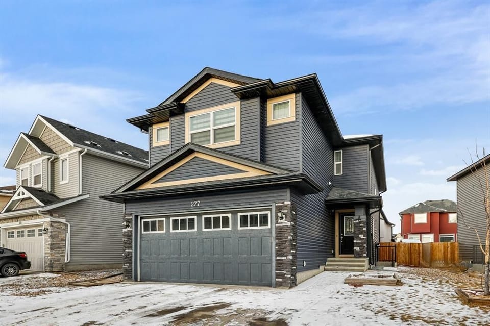 Large 4BR (main floor and upstairs) Family Home! Plenty of parking is available - in the garage, driveway and on the street.
