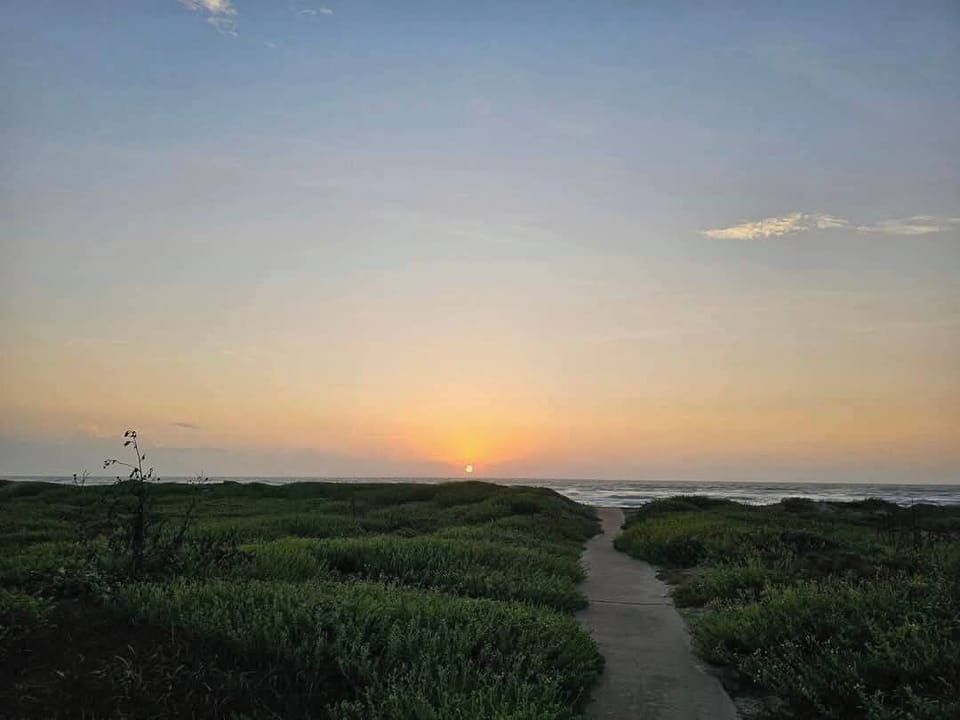 A scenic walkway leading straight to the beach—just steps away from paradise! 