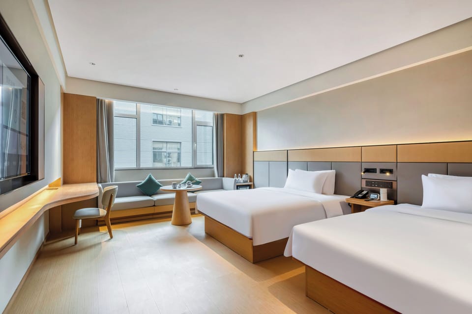 Select Comfort beds, desk, laptop workspace, blackout drapes