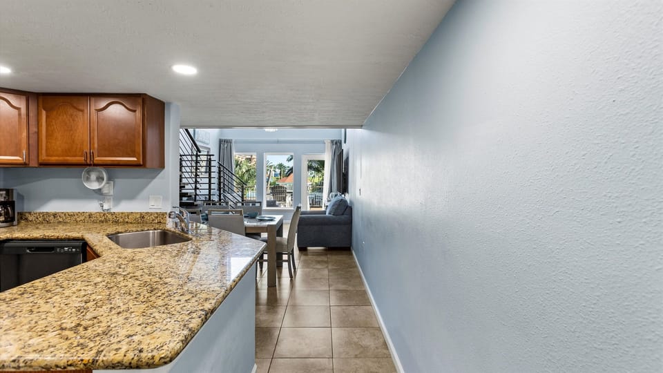 Kitchen located between den and guest bedroom.