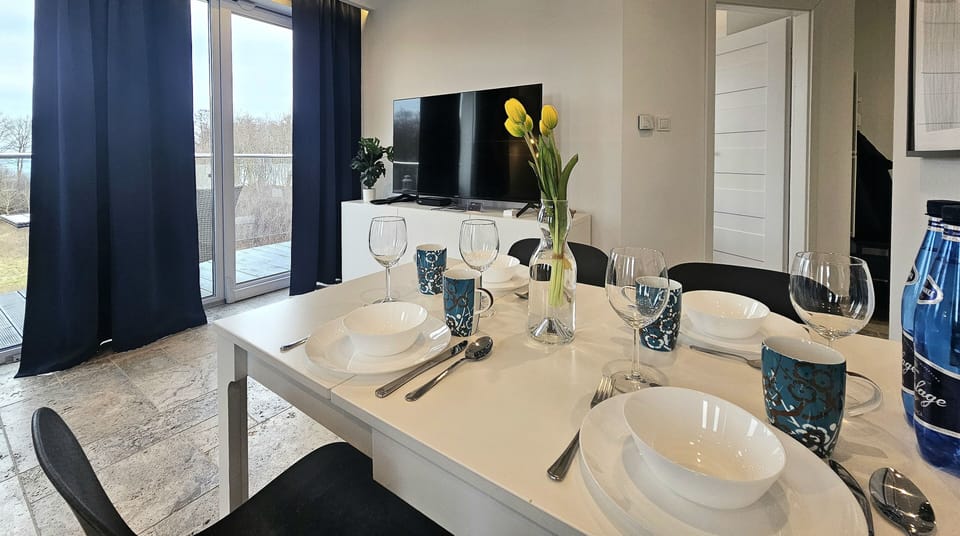 Comfort Apartment, Balcony, Beach View | Living area | 50-inch LCD TV with cable channels