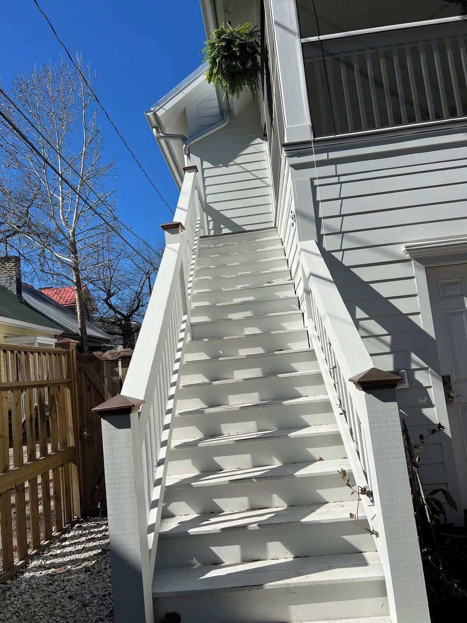Stairs up to screened-in porch and apartment  entrance.  There are 17 steps leading to the second story apartment. 