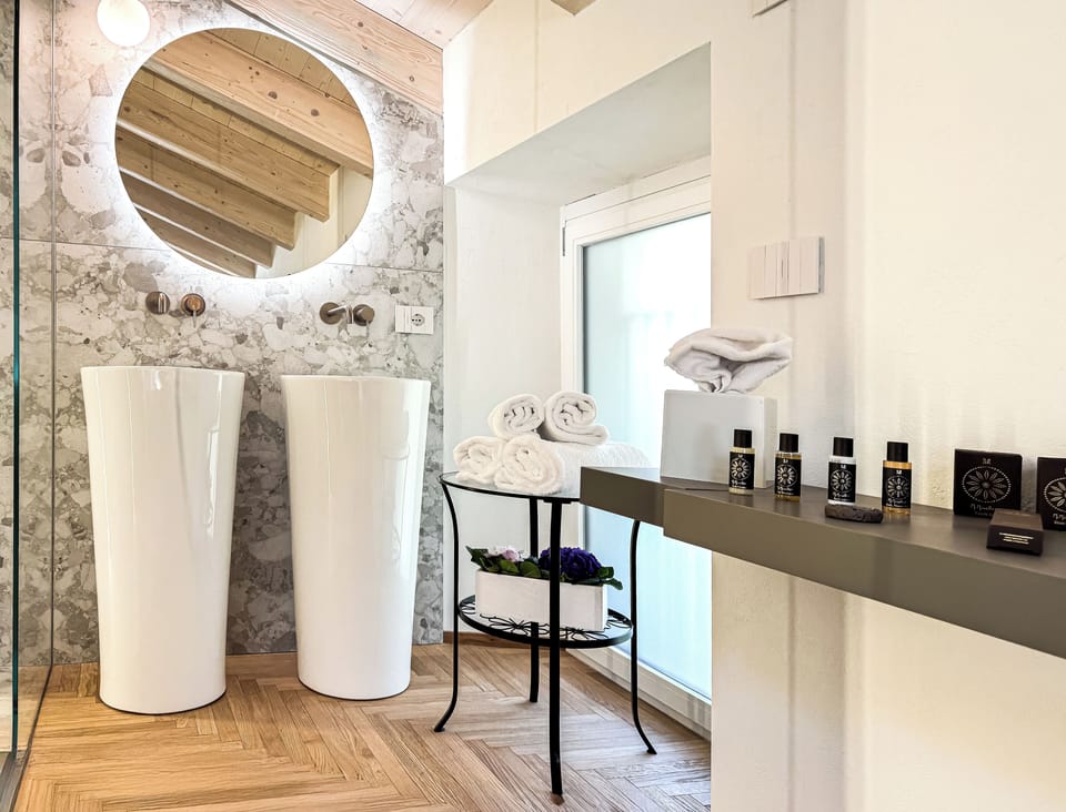 Superior Double Room, Lake View | Bathroom | Shower, rainfall showerhead, designer toiletries, hair dryer