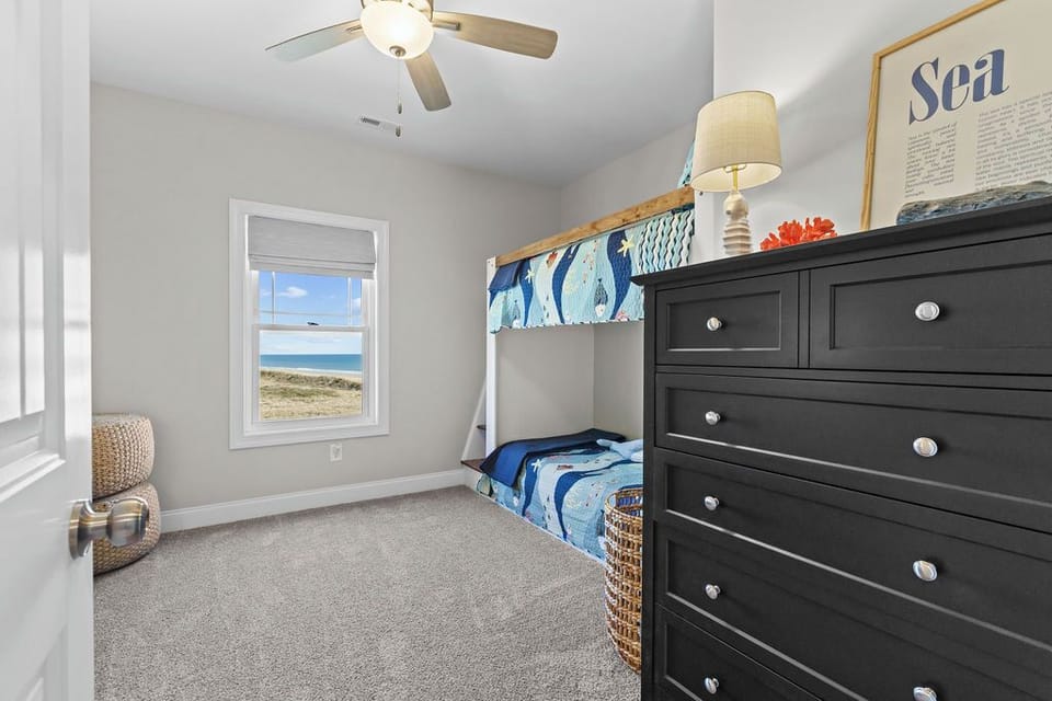 Your children will love this cozy bunk bed room with sea views and nautical charm—perfect for creating vacation memories together.