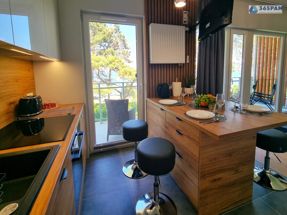 Comfort Apartment, Balcony, Sea View | Living area | 50-inch LCD TV with cable channels