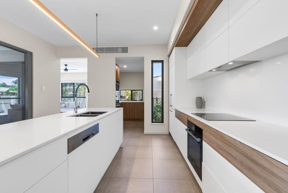 Create delicious meals in this gourmet kitchen, featuring modern appliances, a spacious island, and a butler’s pantry to keep everything effortlessly organised.