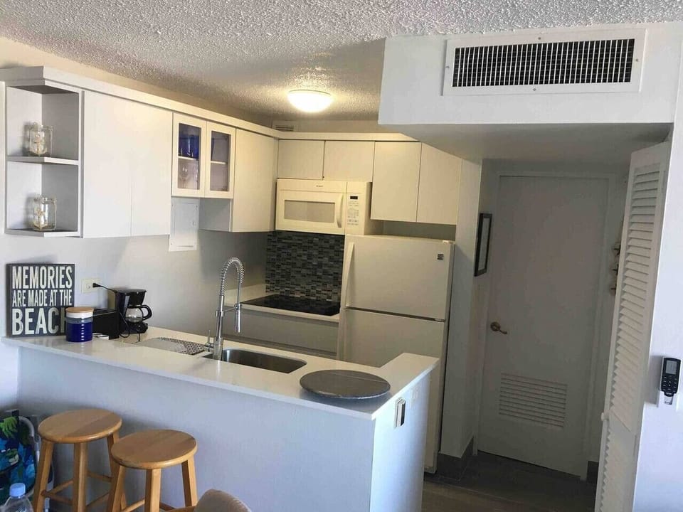 Bright, open kitchen seamlessly connected to the living space