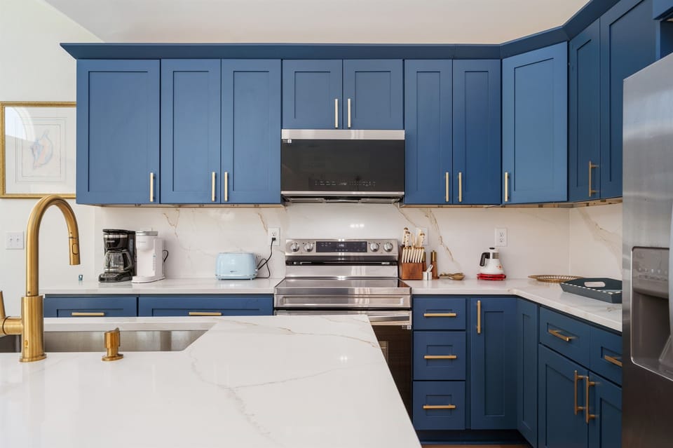 Fully stocked kitchen with stainless steel appliances and plenty of counter space for your culinary creations.
